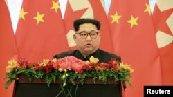 Lãnh tụ Triều Tiên Kim Jong Un phát biểu tại Bắc Kinh nhân chuyến thăm không chính thức. Hình do Thông tấn xã Trung ương Triều Tiên công bố ngày 28/3/18.