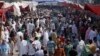 FILE - People visit a crowded market in Lahore, Pakistan, Oct. 30, 2011. In 2015, the World Bank estimated Pakistan's population at 188.9 million but Islamabad still uses a 1998 figure of 134.7 million.