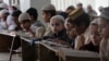 Pakistani children attend lessons at a madrassa, or a religious school, to learn Quran, in Karachi, Pakistan, Sept. 2, 2015. 