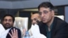 Pakistan's Finance Minister Asad Umar speaks during a visit to the Karachi Stock Exchange in Karachi on Oct. 20, 2018. 