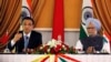 Chinese Premier Li Keqiang (L) speaks with the media as India's Prime Minister Manmohan Singh looks on during the signing of agreements ceremony in New Delhi, May 20, 2013. 