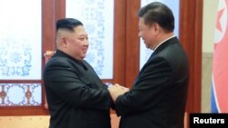 Ông Kim Jong Un và Chủ tịch Tập trong cuộc gặp đầu năm 2019 ở Bắc Kinh.