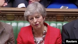 Thủ tướng Anh Theresa May phản ứng trước kết quả cuộc biểu quyết về thỏa thuận Brexit trong Nghị viện ở London, Anh, ngày 12 tháng 3, 2019.