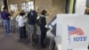 People vote early at the Salt Lake County Government Building in Salt Lake City, October 30, 2012.