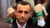 Former Afghan intelligence Chief Amrullah Saleh, wears a green wristband which reads " Basij e Melli" which is a symbol of the National Movement, during an Afghan government opposition rally in Kabul, Afghanistan, Wednesday May 5, 2011. (AP Photo/Kamran J