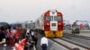 FILE - Kenyan President Uhuru Kenyatta (3rd-L) watches the opening of the SGR cargo train as it leaves the port containers depot in Mombasa to Nairobi, May 30, 2017. The project, a $3.3 billion investment backed by China, is the country's largest infrastr