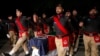 Pakistani police officers attend the funeral of their colleague Tahir Dawar in Peshawar, Pakistan, Nov. 15, 2018. 