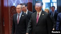 Tổng thống Nga Vladimir Putin và Chủ tịch Trung Quốc Tập Cận Bình tại Trung tâm Hội nghị Quốc tế ở Hồ Yanqi, Bắc Kinh ngày 15/5/2017.